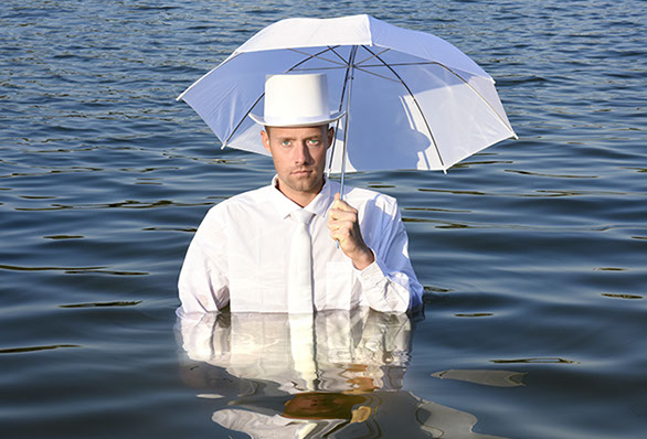 staged art photography staged art photography, a man with an umbrella in the water